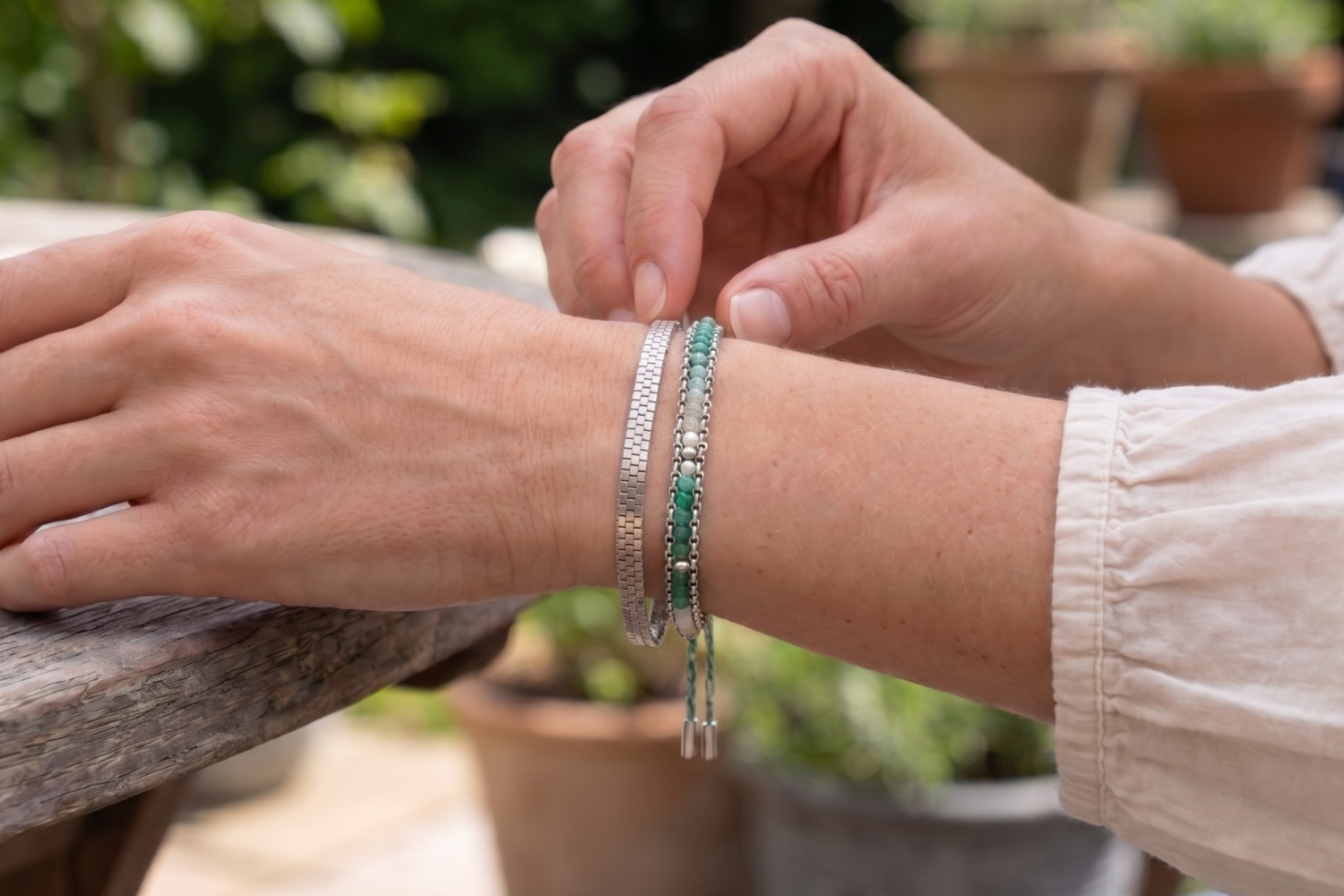 Vaadhoo Turquoise and Silver Bracelet Stack styled on the wrist, showcasing turquoise-toned woven gemstone detailing and polished silver bracelets for relaxed everyday styling.