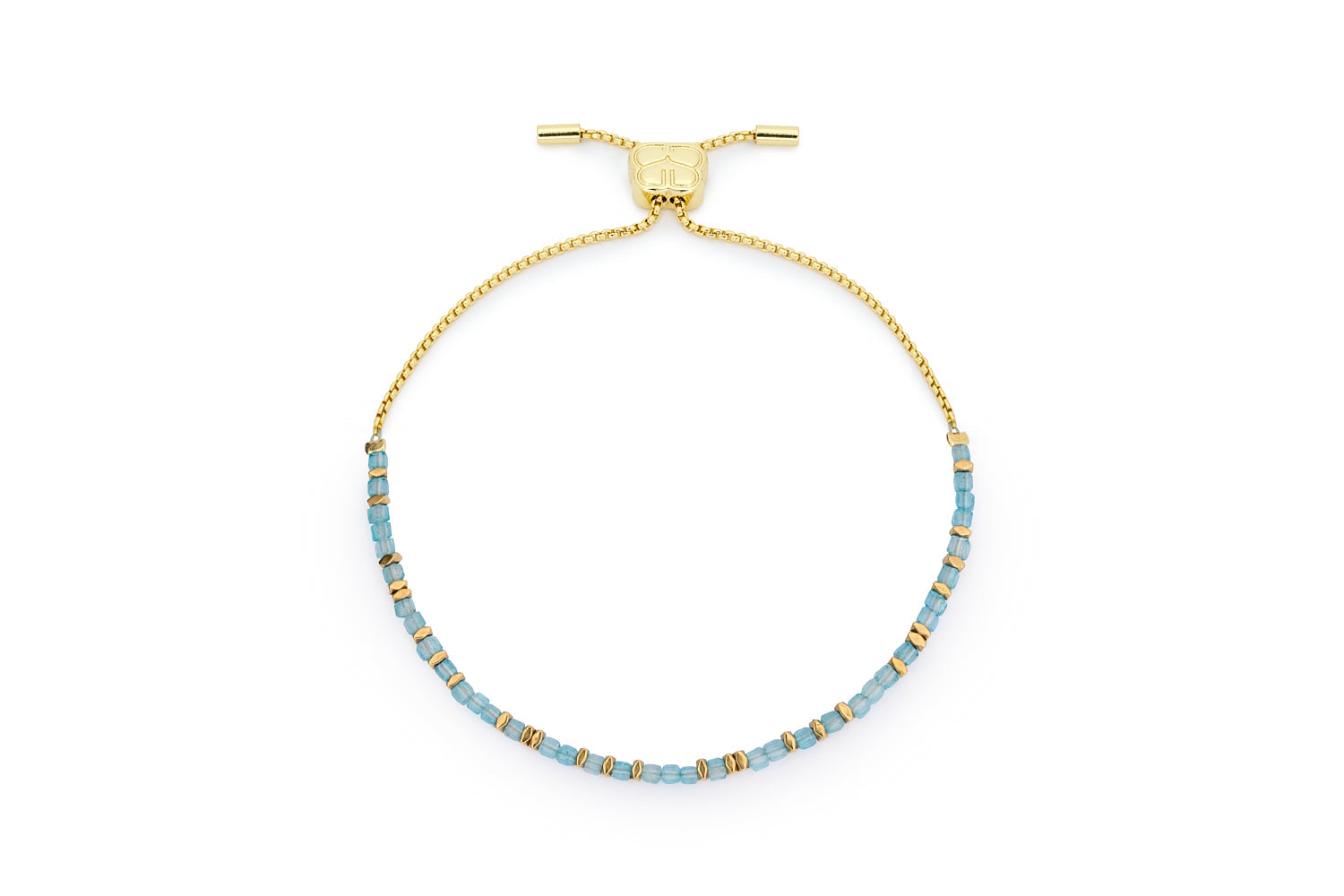 Valentina gold November birthstone bracelet with blue topaz faceted cube beads and Boho Betty charm on white background