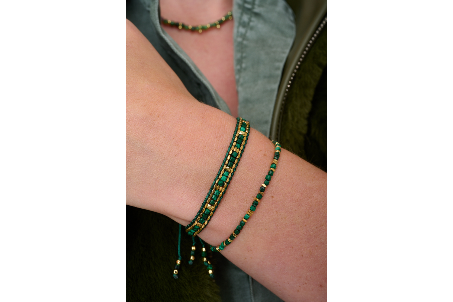 Valentina Gold & Malachite Bead Slider Bracelet styled for boho-chic layering, showcasing the bold green malachite beads with gold-plated accents—perfect for stacking or wearing solo for a vibrant, earthy touch.