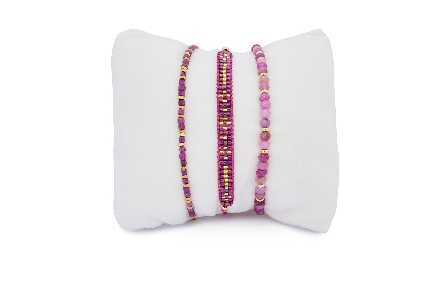 Vik Ruby Gold Bracelet Stack featuring three ruby and gold-toned bracelets with faceted gemstone beads, woven detail, and rich berry hues.