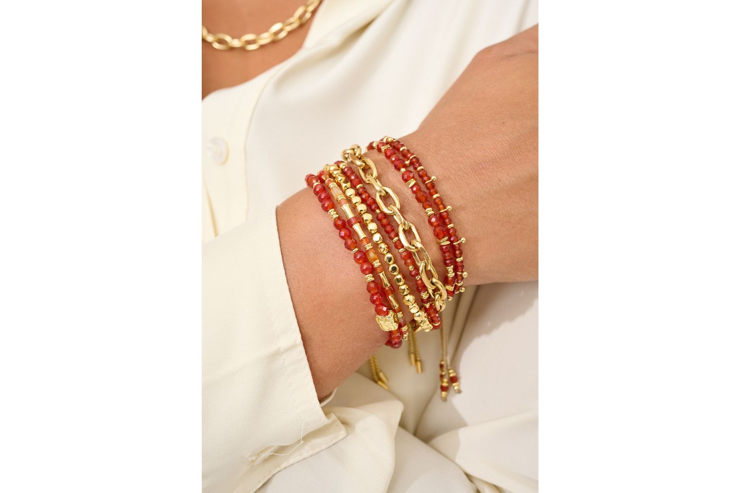 Wonder Gold & Orange Agate Gemstone Bead Bracelet styled on a wrist, showcasing its vibrant orange hues, gold details, and cheerful boho aesthetic, perfect for everyday zest.