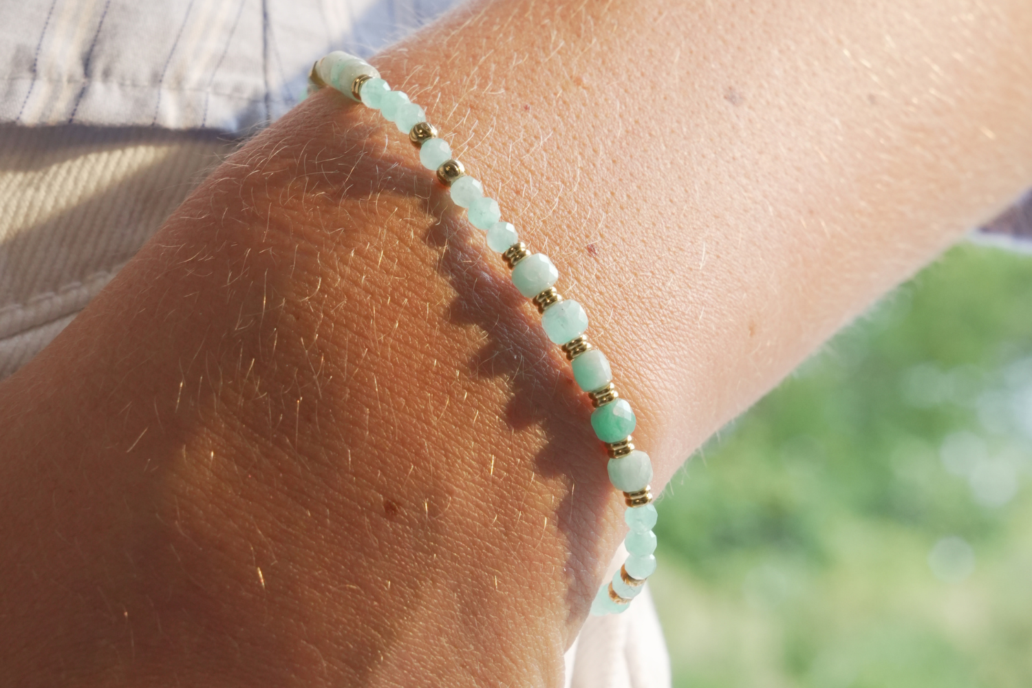 Yasmin Amazonite Gold Gemstone Bead Bracelet worn stacked on the wrist with natural Amazonite gemstone beads and waterproof 14k Gold PVD stainless steel accents.