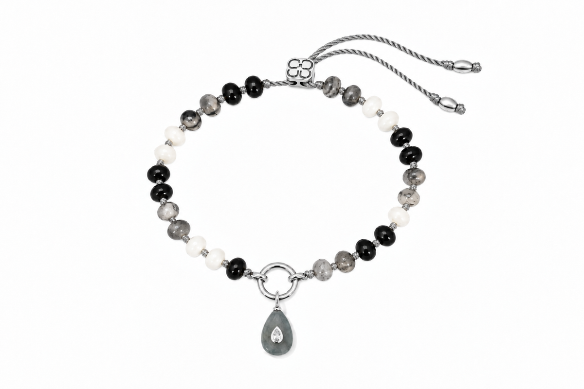 Zaha Black Mix silver charm carrier bracelet finished with a Fleurette labradorite teardrop charm, a waterproof Boho Betty gemstone bracelet.