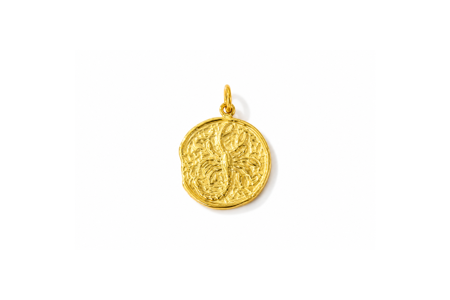 Zaya Scorpio Gold Waterproof Zodiac Charm featuring a textured coin-inspired design with a raised Scorpio symbol in waterproof 14k Gold PVD-coated stainless steel.