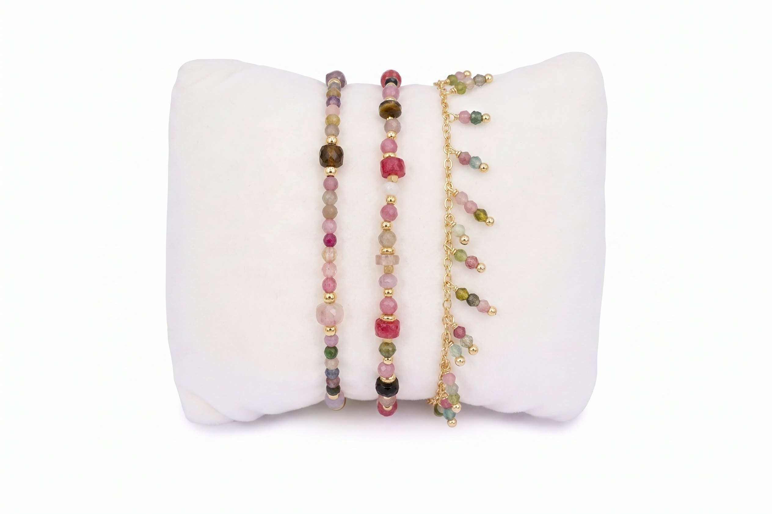 Zelda Gold & Tourmaline Bracelet Stack, three delicate bracelets in berry-hued tourmaline with gold accents and chain drops