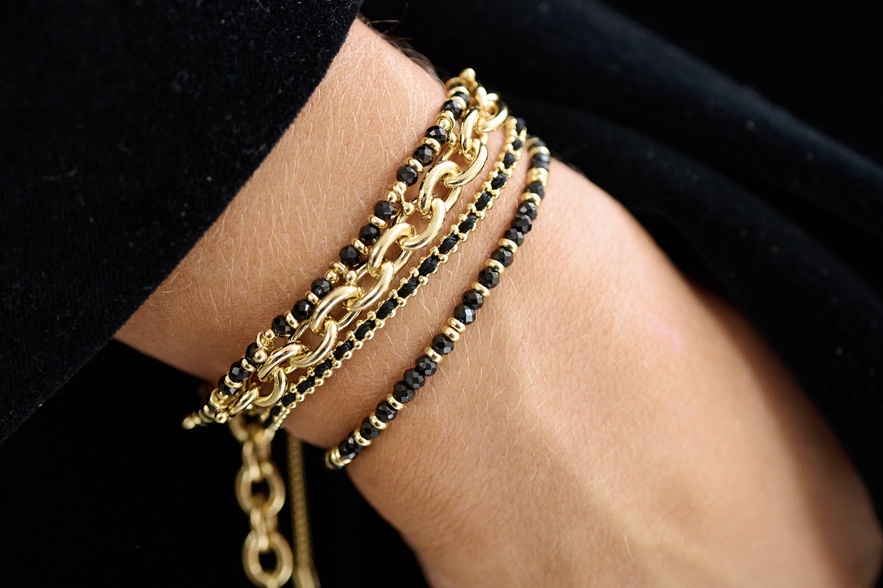 Bold Chunky Chain Gold Bracelet styled with a sleek outfit, showcasing its chunky gold links for a striking, modern statement.