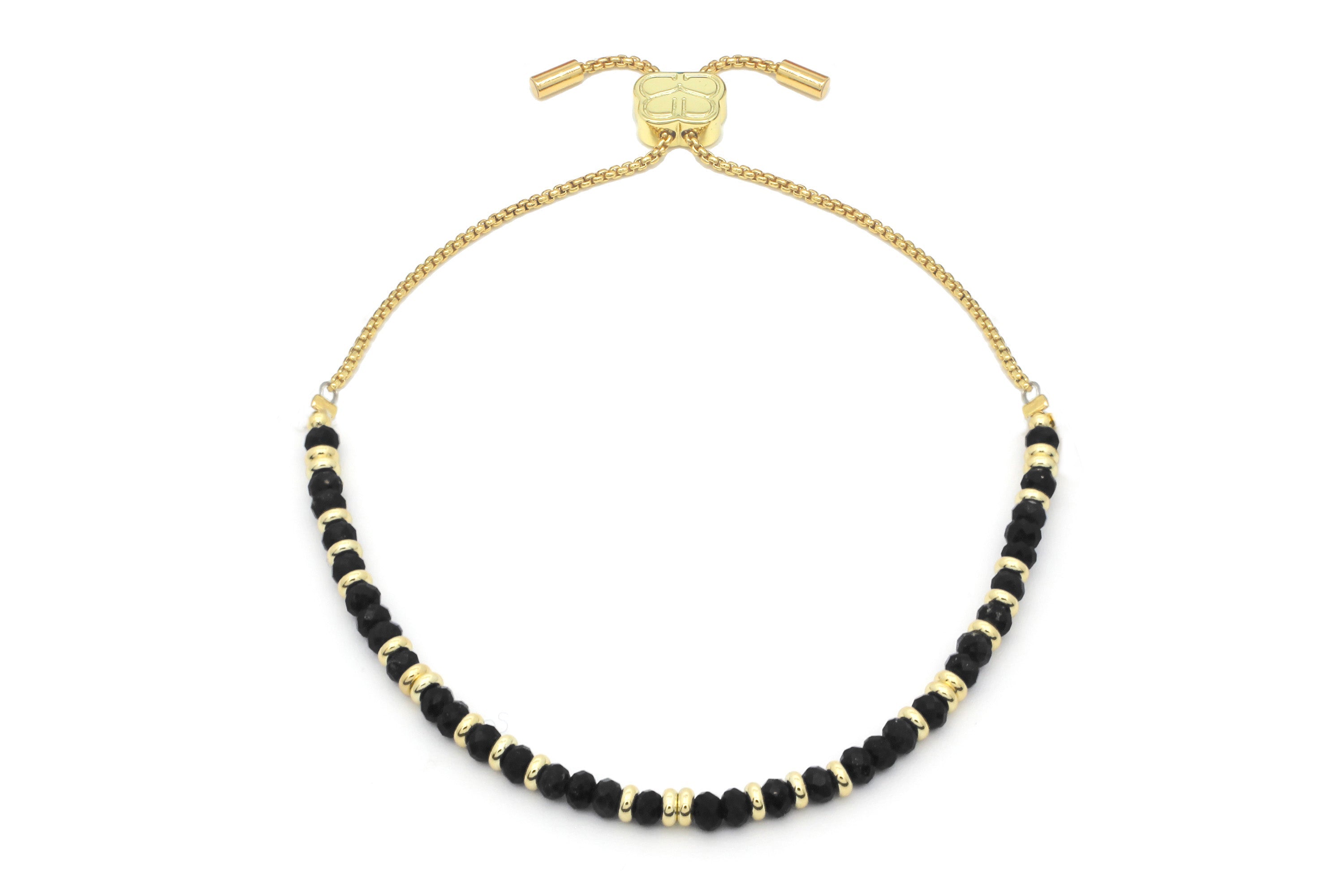 Mystical Black Spinel Gold Bracelet featuring faceted black spinel gemstones, 12k gold-plated beads, and an adjustable slider chain.