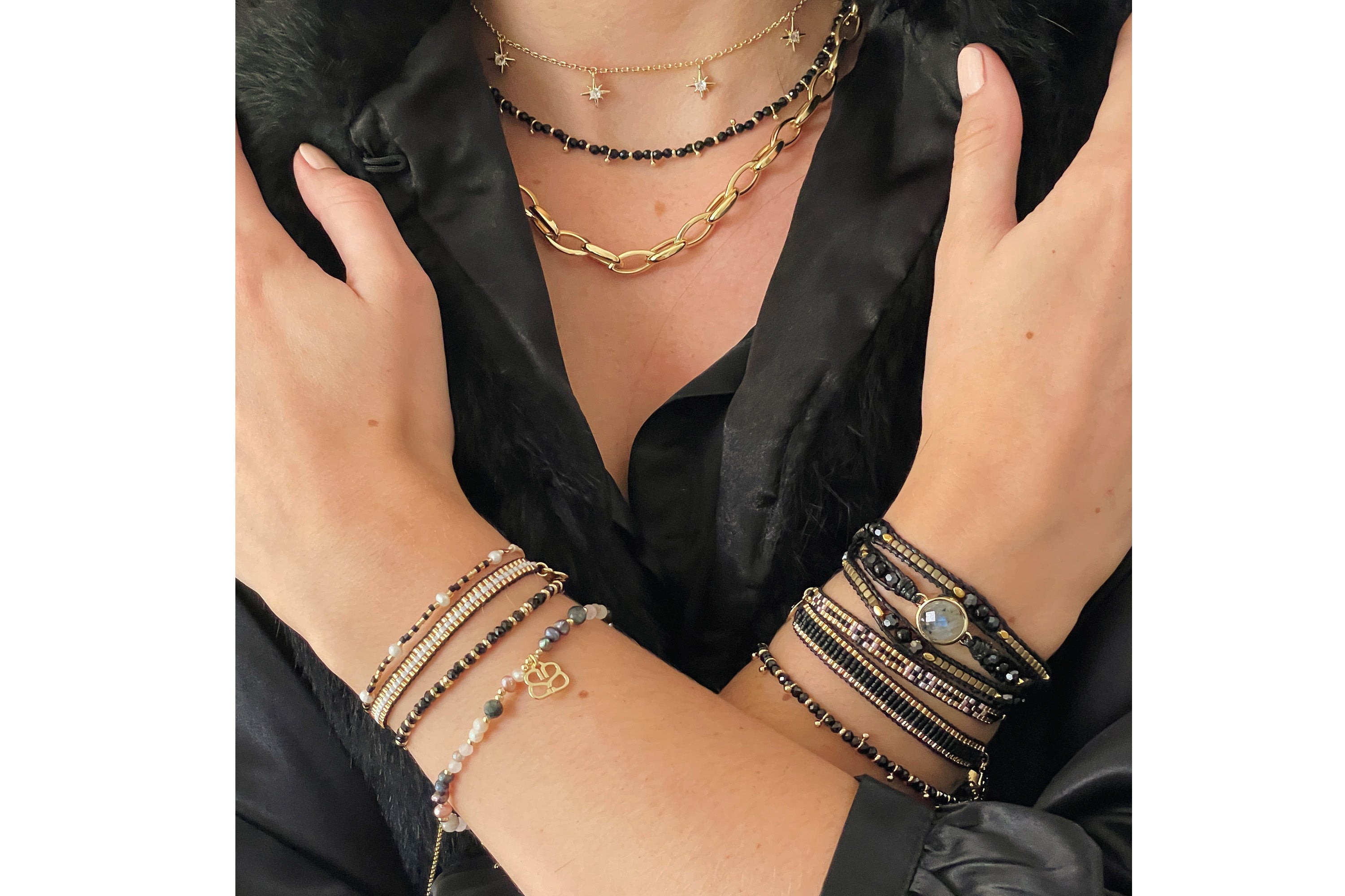 Salus Black Spinel Necklace styled with gold jewellery for a refined, empowering, and quietly bold look.