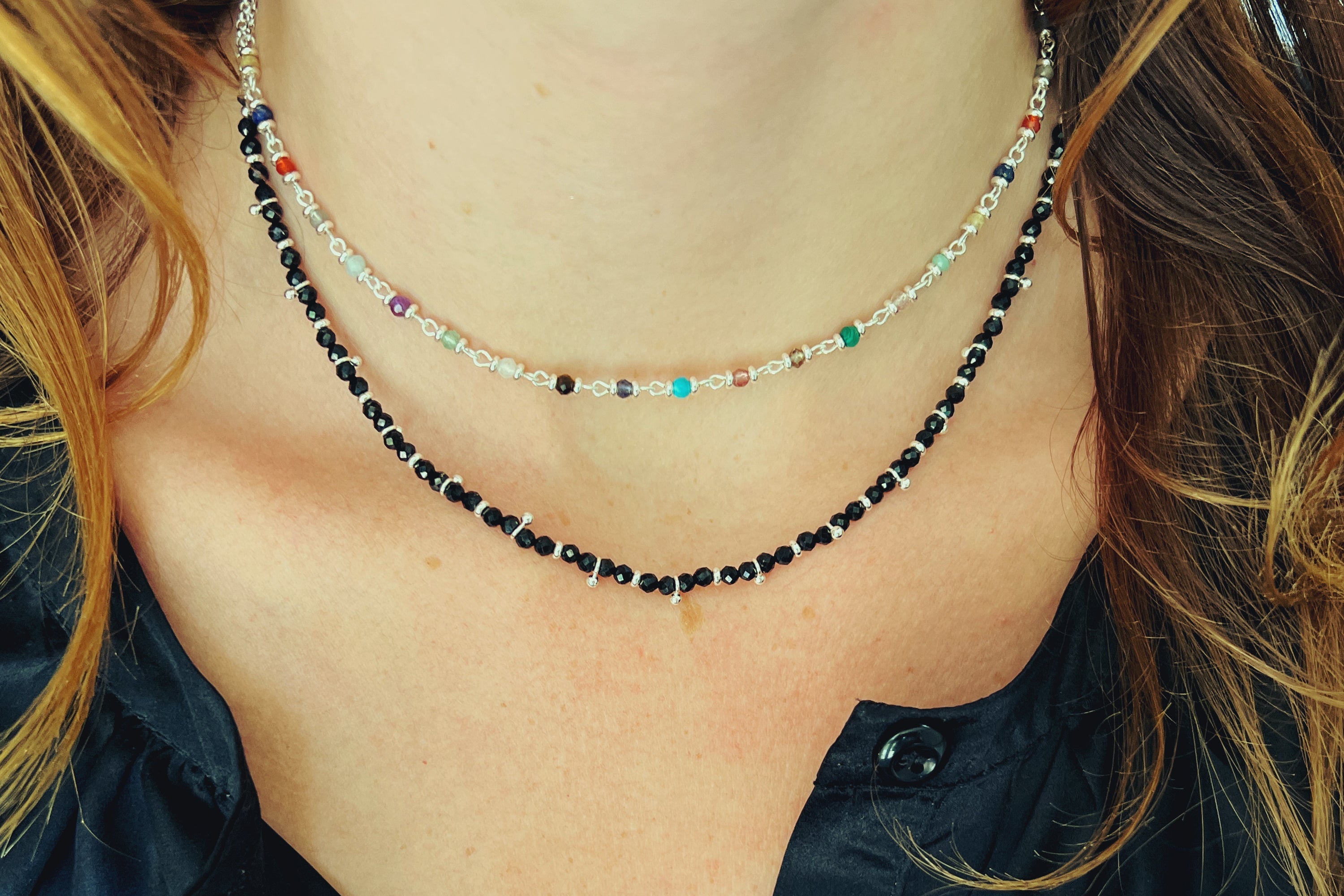 Black Spinel Gemstone Necklace styled with a silver jewellery stack for a sleek, empowering everyday look.